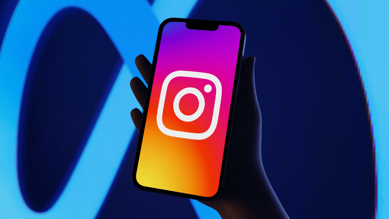 Hand holding phone with Instagram open